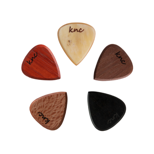 The 5 assorted handmade wooden picks (Ebony, Maple, Walnut, Padouk, Purpleheart) laid side-by-side to show the different wood types.