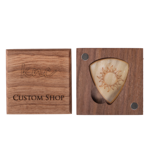 The 'Burning Sun' horn pick presented in its optional Knc Picks premium wooden gift box