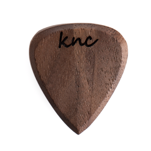 A personalized 'The Boss' walnut pick with a custom name laser-engraved below the Knc logo.