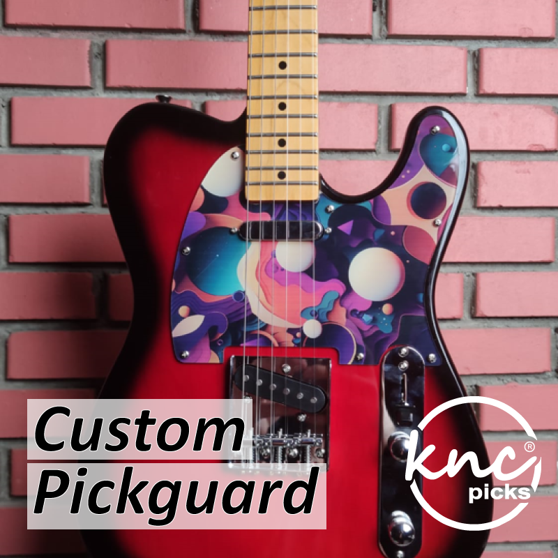 A vibrant, custom-printed acrylic pickguard from Knc Picks, showing a full-color graphic design on a Stratocaster-style guitar.