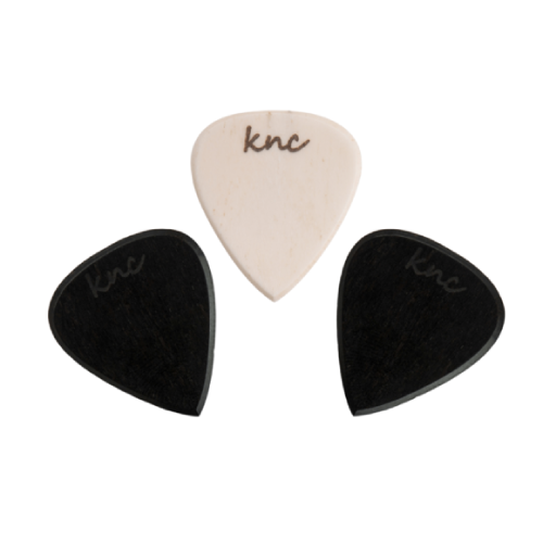 The three premium metal picks laid side-by-side, showing their identical shape and polished metallic finish.