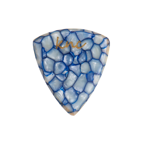 A Knc Picks handmade guitar pick made from Blue Galalith (Casein), showing the vibrant, pearlescent blue swirl patterns.