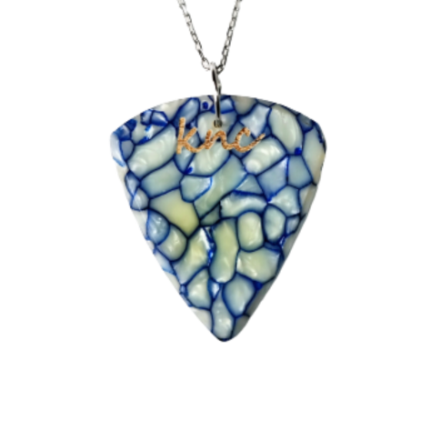 A handmade Knc Picks guitar pick made from vibrant, pearlescent Blue Galalith (Casein) material, attached to a stylish necklace chain.
