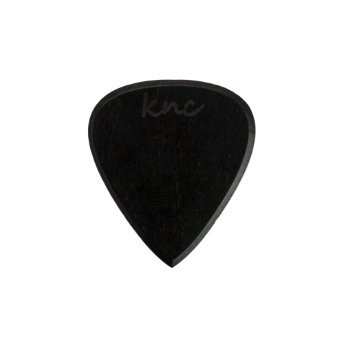 A handmade Knc Picks Custom Ebony Pick, showing its pure black color and polished, smooth texture.
