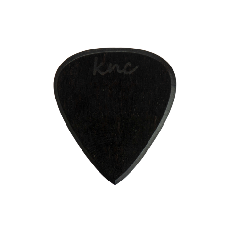 A handmade Knc Picks Custom Ebony Pick, showing its pure black color and polished, smooth texture.
