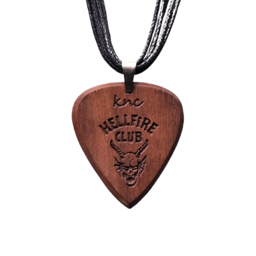 A handmade Knc Picks Walnut wood pick necklace, laser-engraved with the 'Hellfire' logo inspired by Eddie Munson (Stranger Things).