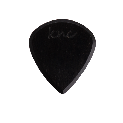 A Knc Picks handmade 'Lil One' (Jazz-style) guitar pick, crafted from natural pure black Ebony wood, highlighting its small, sharp shape.