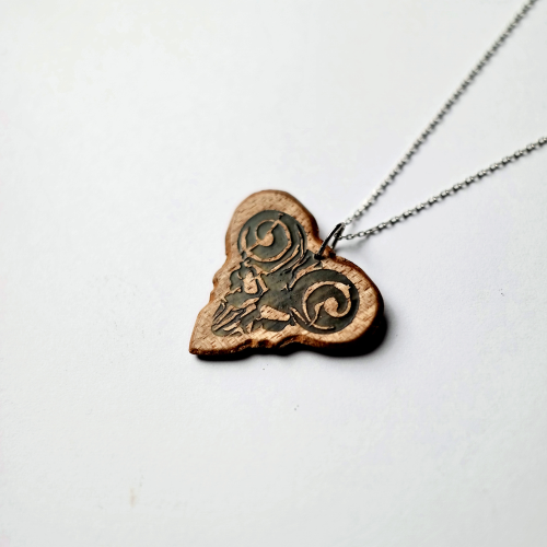 The Knc Picks 'Pick of Destiny' guitar pick, showing its movie-inspired design and green Luminous Galalith material.