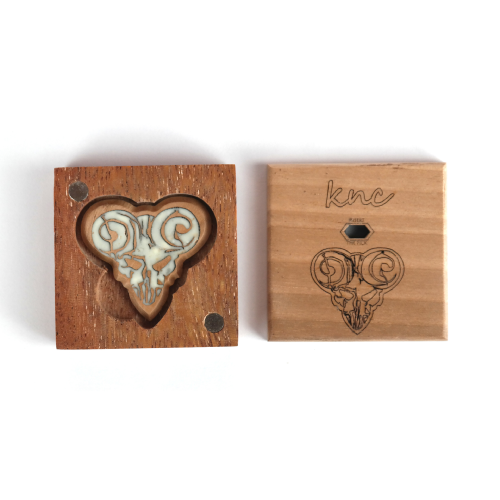 The 'Pick of Destiny' glowing Walnut pick presented in its Knc Picks premium wooden gift box.