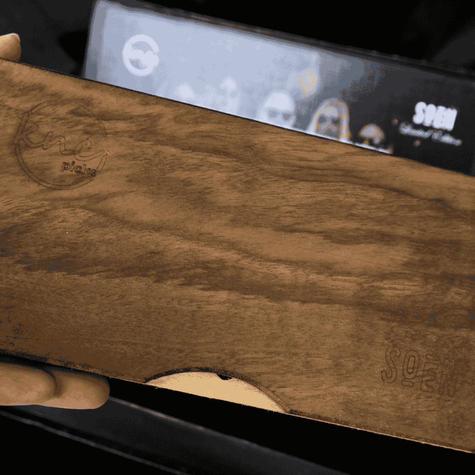 The exterior of the premium engraved wooden collector's box for the limited edition SOEN pick set by Knc Picks